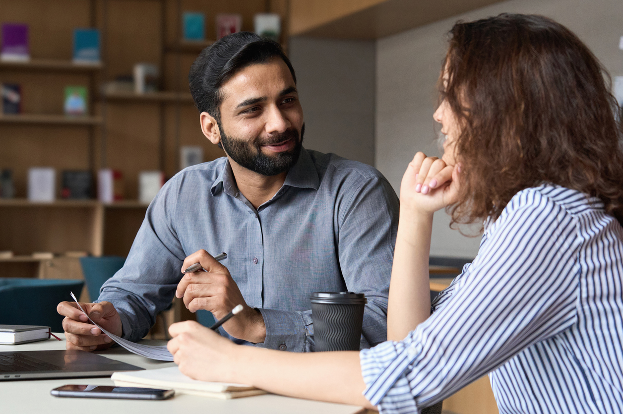 Two people meeting for review