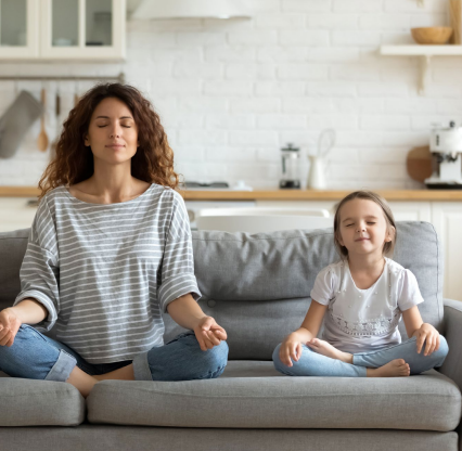 Mother and child meditating