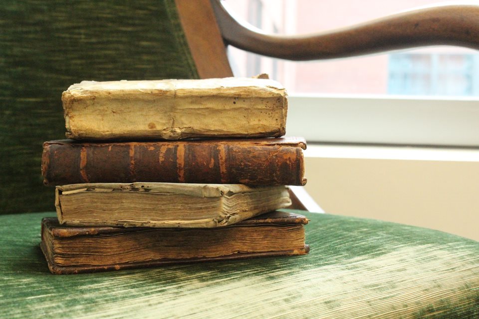 stack of books on chair