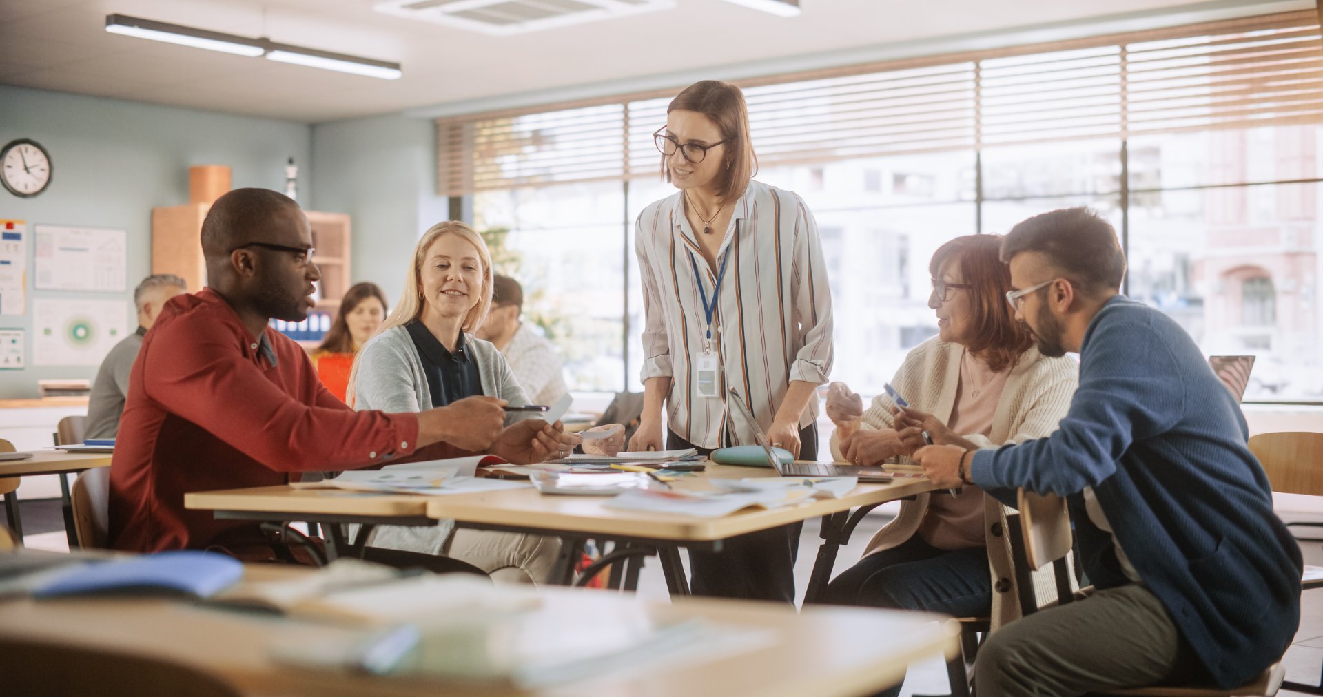 Teachers talking together in a classroom