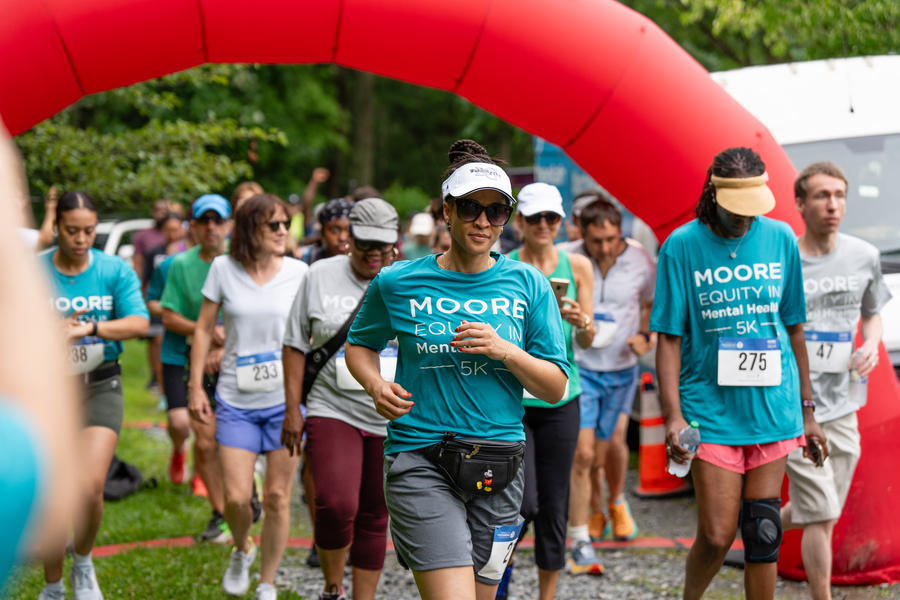 Group of people running a race, on the starting line