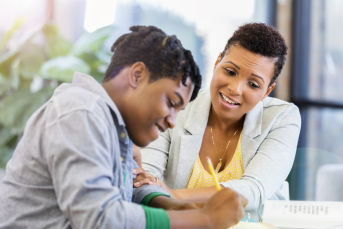 Mom helping son with homework