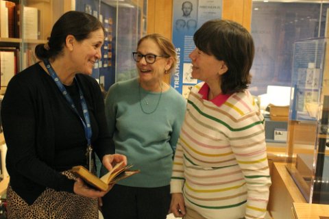 group of people talking in library